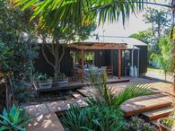 Set amongst tropical gardens...